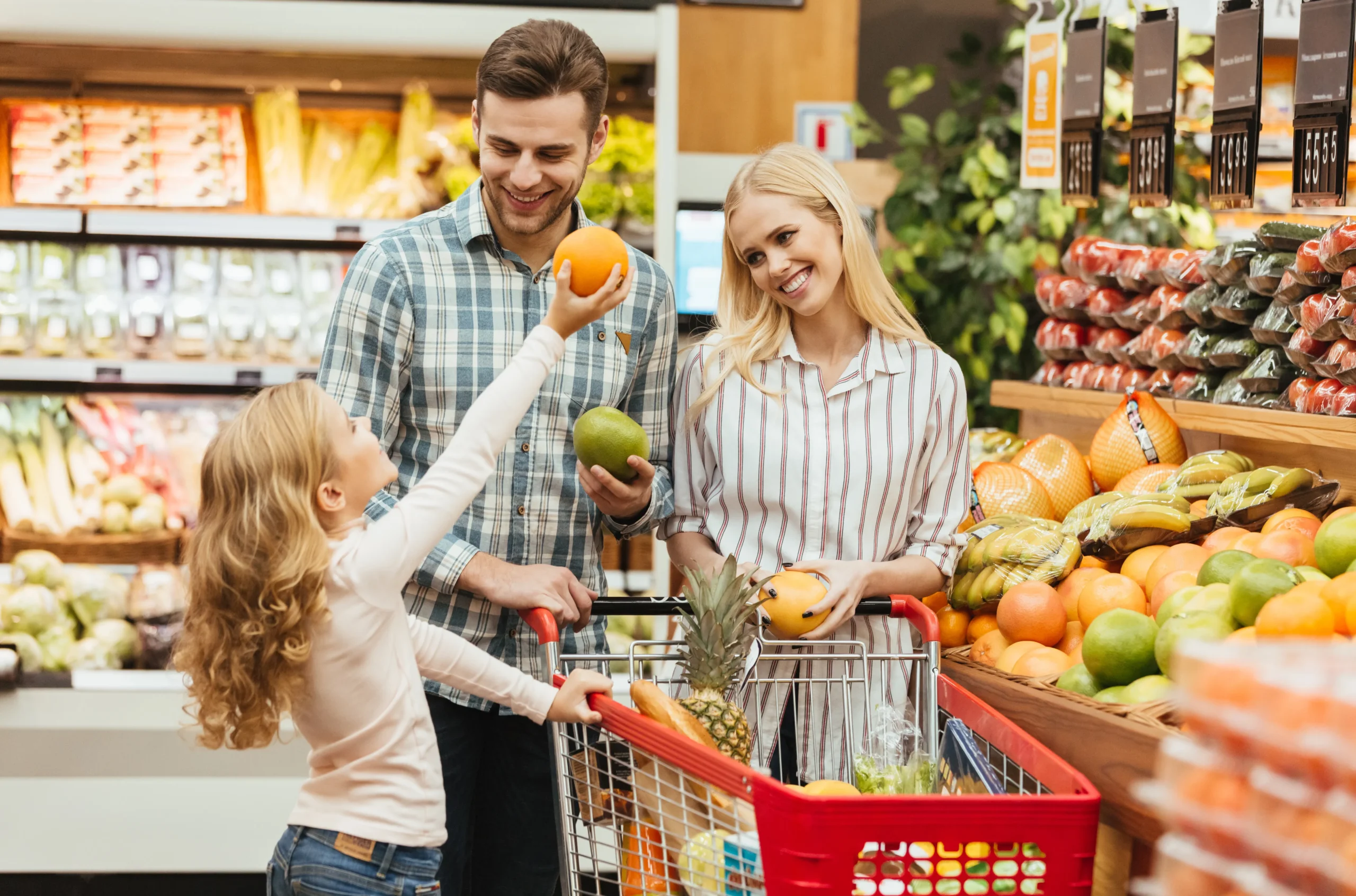 happy-young-family-standing-with-trolley_11zon